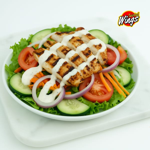 Grilled chicken salad with lettuce, tomatoes, cucumbers, red onions, carrots, and ranch dressing.